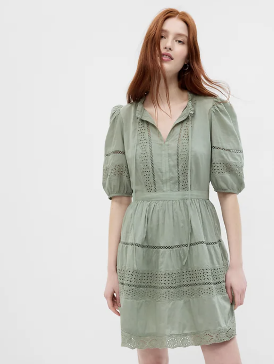 red head model wearing light green Puff Sleeve Lace Mini Dress (Photo via GAP)