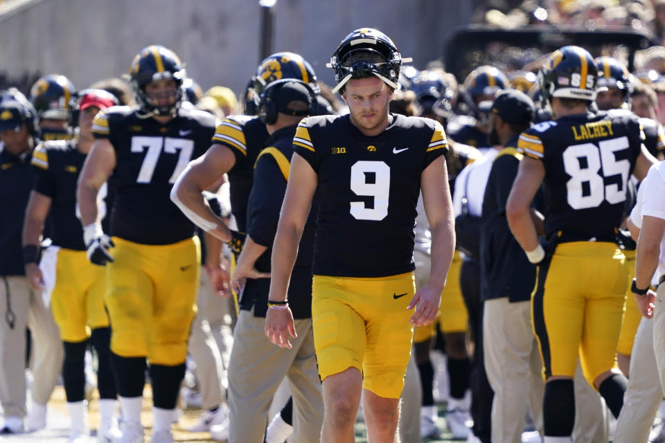 Iowa punter Tory Taylor (9) walks on the sideline during the second half of an NCAA college football game against Michigan, Saturday, Oct. 1, 2022, in Iowa City, Iowa. Michigan won 27-14. (AP Photo/Charlie Neibergall)