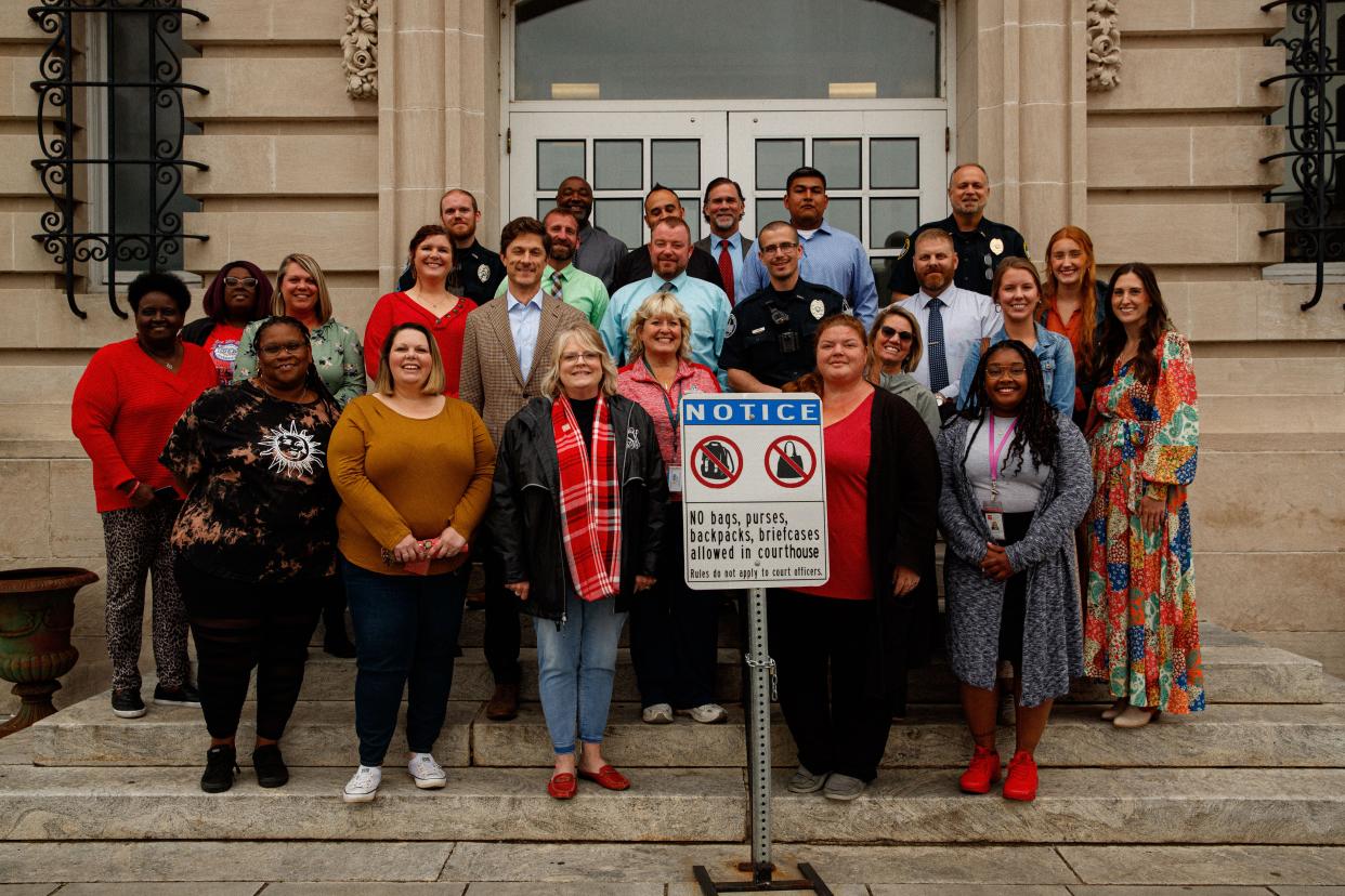 Volunteers from around Maury County stand together for a group photo after participating in a Red Sand Project event at the Maury County Courthouse to raise awareness of the vulnerabilities that lead to human trafficking in Columbia, Tenn. on Apr. 27, 2023. 