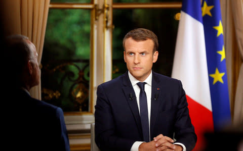 French President Emmanuel Macron is seen during his first long live television interview on prime time at the Elysee Palace in Paris, France, October 15 - Credit: PHILIPPE WOJAZER/Reuters