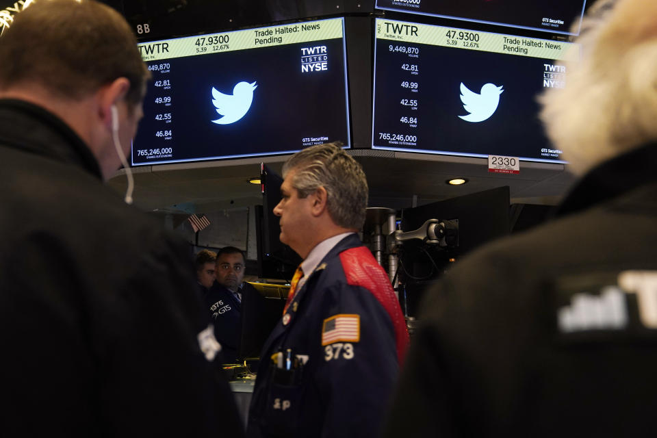 The symbol for Twitter appears above a trading posts on the floor of the New York Stock Exchange, Tuesday, Oct. 4, 2022. Trading in shares of Twitter was halted after the stock spiked on reports that Elon Musk would proceed with his $44 billion deal to buy the company after months of legal battles.(AP Photo/Seth Wenig)