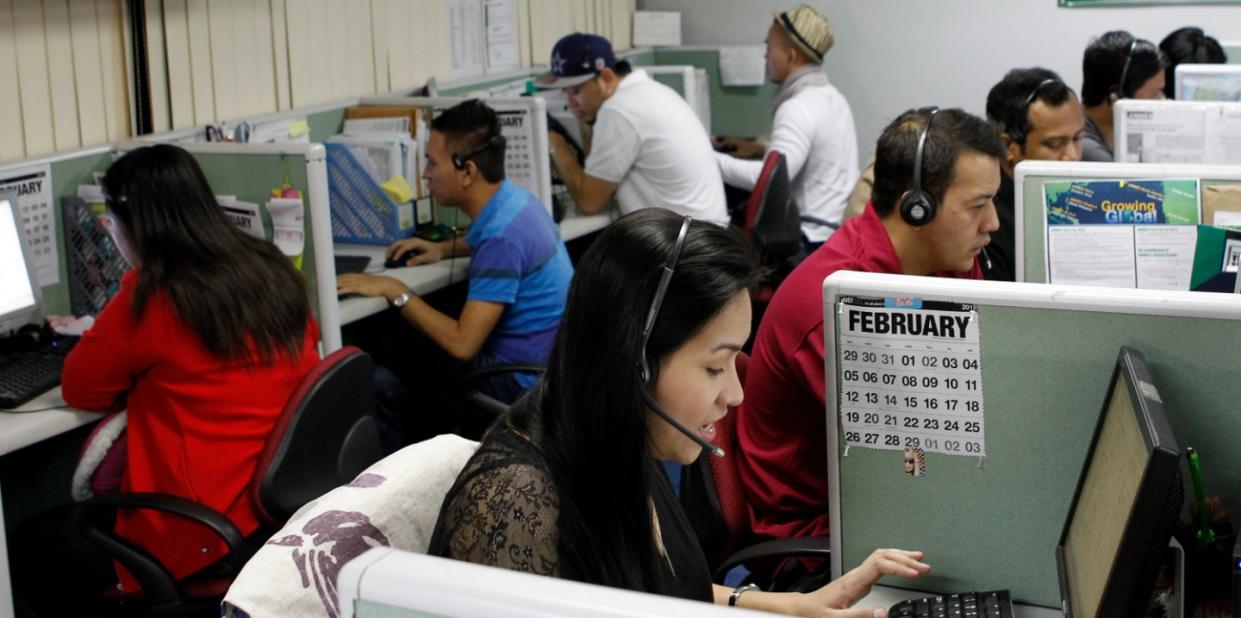 Call center agents work overnight daily to cater to United States clients in Manila's Makati financial district February 6, 2012. REUTERS/Erik De Castro