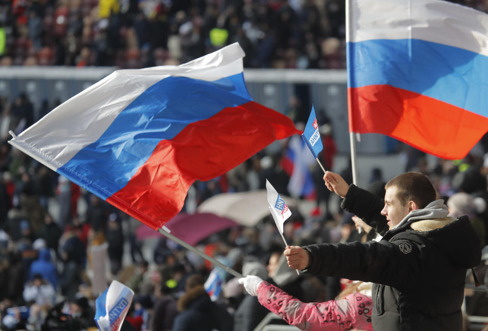 <p>People take part in a rally to support Russian President Vladimir Putin in the upcoming presidential election at Luzhniki Stadium in Moscow, Russia, March 3, 2018. (Photo: Maxim Shemetov/Reuters) </p>