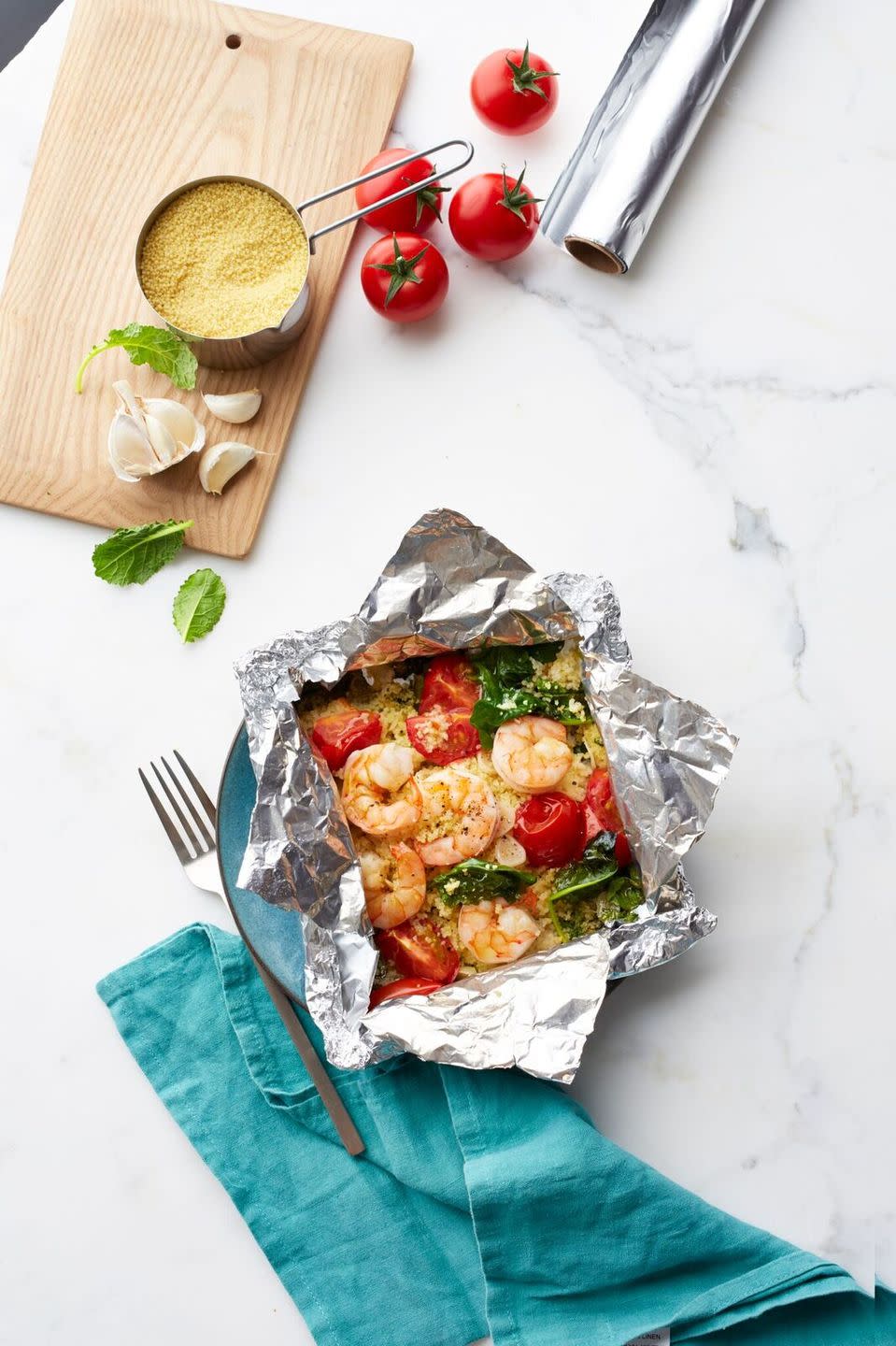 <p>Go Mediterranean with these easy shrimp foil packets. According to a 2015 study published in <a href="https://www.sciencedirect.com/science/article/pii/S0033062015000286" rel="nofollow noopener" target="_blank" data-ylk="slk:Progress in Cardiovascular Disease;elm:context_link;itc:0" class="link "><em>Progress in Cardiovascular Disease</em></a>, a Mediterranean diet that's low in unsaturated fat and polyphenols may work to prevent cardiovascular disease.</p><p><a href="https://www.womansday.com/food-recipes/food-drinks/recipes/a55761/shrimp-and-garlicky-tomatoes-with-kale-couscous-recipe/" rel="nofollow noopener" target="_blank" data-ylk="slk:Get the Shrimp and Garlicky Tomatoes with Kale Couscous recipe.;elm:context_link;itc:0" class="link "><em><strong>Get the Shrimp and Garlicky Tomatoes with Kale Couscous recipe.</strong></em></a></p><p><strong><a class="link " href="https://www.amazon.com/Reynolds-Wrap-Aluminum-Foil-Square/dp/B00UNT0Y2M/r?tag=syn-yahoo-20&ascsubtag=%5Bartid%7C10070.g.2176%5Bsrc%7Cyahoo-us" rel="nofollow noopener" target="_blank" data-ylk="slk:SHOP FOIL;elm:context_link;itc:0">SHOP FOIL</a></strong></p>