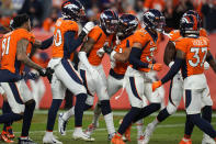 Denver Broncos cornerback Pat Surtain II (2) celebrates his interception with teammates during the second half of an NFL football game against the Los Angeles Chargers, Sunday, Nov. 28, 2021, in Denver. (AP Photo/Jack Dempsey)