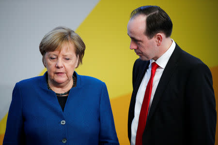 German Chancellor Angela Merkel and and leader of the CDU state group of Brandenburg, Ingo Senftleben attend a strategy meeting of Germany's governing Christian Democratic Union (CDU) party in Potsdam, Germany, January 14, 2019. REUTERS/Axel Schmidt