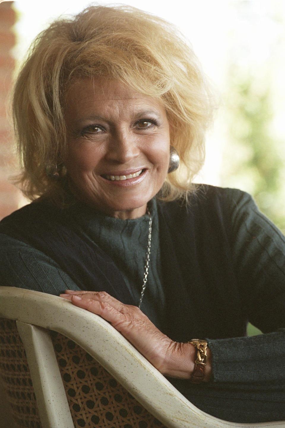 FILE - Actress Angie Dickinson poses in Beverly Hills, Calif., on Aug. 8, 1996. Dickinson is helping to kick off this year's TCM Classic Film Festival this week in Hollywood with a screening and a discussion of the 1959 classic "Rio Bravo." (AP Photo/Susan Sterner, File)