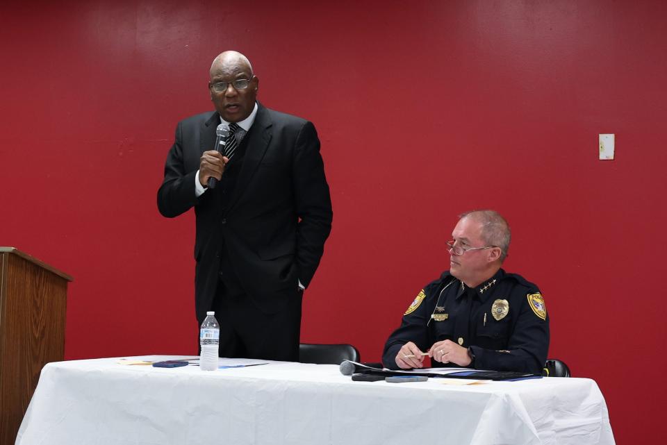 Rev. R.B. Holmes Jr., left, speaks at a crime prevention task force meeting at Bethel Family Life Center on Monday, Nov. 14, 2022. Tallahassee Police Chief Lawrence Revell sits to Holmes' left.