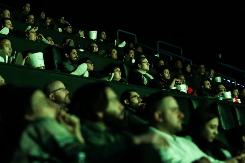 People watch the movie during the "Star Wars: The Rise of Skywalker" movie opening night fan event in New York City