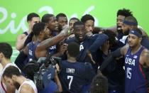 2016 Rio Olympics - Basketball - Semifinal - Men's Semifinal Spain v USA - Carioca Arena 1 - Rio de Janeiro, Brazil - 19/8/2016. United States players celebrate their victory over Spain. REUTERS/Mariana Bazo