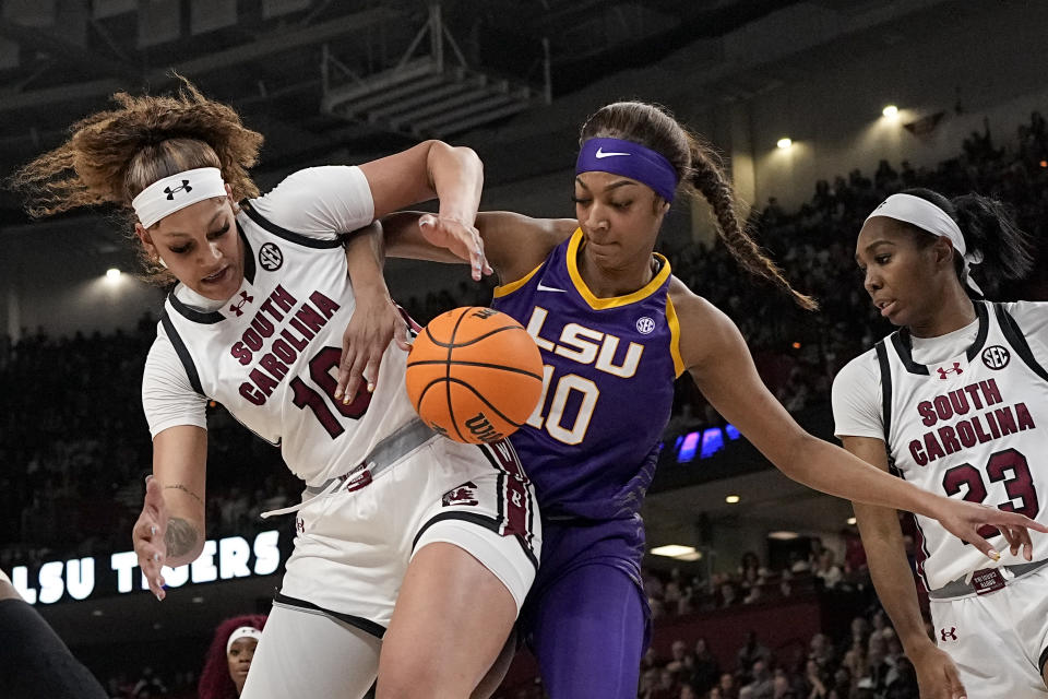 South Carolina center Kamilla Cardoso vies for the ball with LSU forward Angel Reese during the first half of an NCAA college basketball game at the Southeastern Conference women's tournament final Sunday, March 10, 2024, in Greenville, S.C. (AP Photo/Chris Carlson)