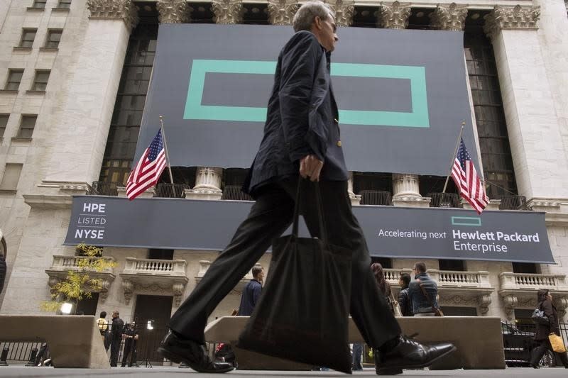 Signs for Hewlett Packard Enterprise Co. cover the facade of the New York Stock Exchange November 2, 2015. REUTERS/Brendan McDermid