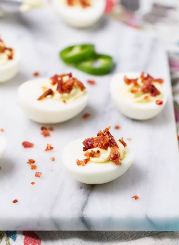 <p>Ari's Menu</p><p>Jalapeno poppers and deviled eggs come together for a bold, spicy and delicious app. </p><p><strong>Get the recipe: <a href="http://www.arismenu.com/jalapeno-popper-deviled-eggs/" rel="nofollow noopener" target="_blank" data-ylk="slk:Jalapeño Popper Deviled Eggs;elm:context_link;itc:0;sec:content-canvas" class="link ">Jalapeño Popper Deviled Eggs</a></strong></p>