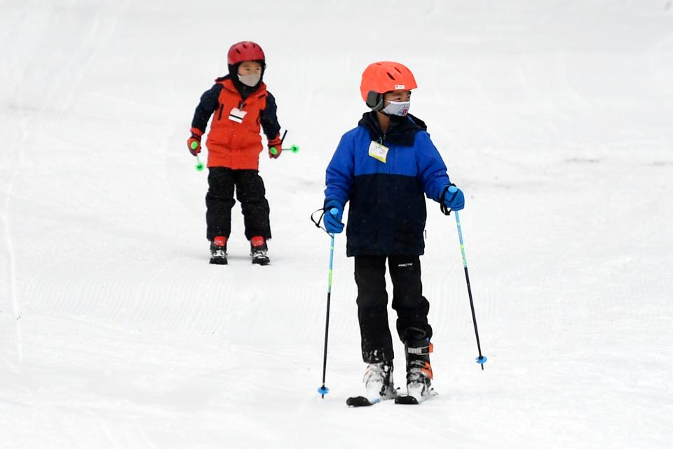 Brothers Matthew (right), 8, and Joseph, 7, of Mahwah, ski at Campgaw Mountain after the snow storm on Tuesday, February 2, 2021, in Mahwah.