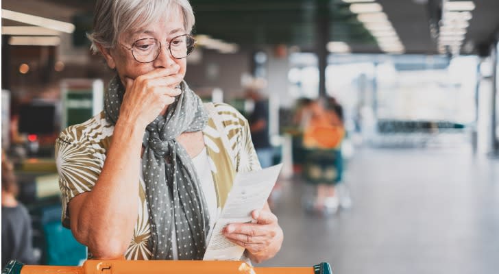 A woman looking at how expensive retirement is in her area, thinking about a new place to retire on $3,000 per month