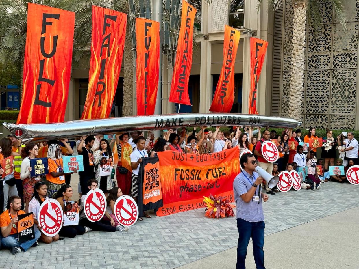 A demonstration at COP28 in Dubai on Dec. 5, 2023. Throughout the two-week climate summit, environmental activists have unleashed a torrent of criticism toward the oilpatch. (Kyle Bakx/CBC - image credit)