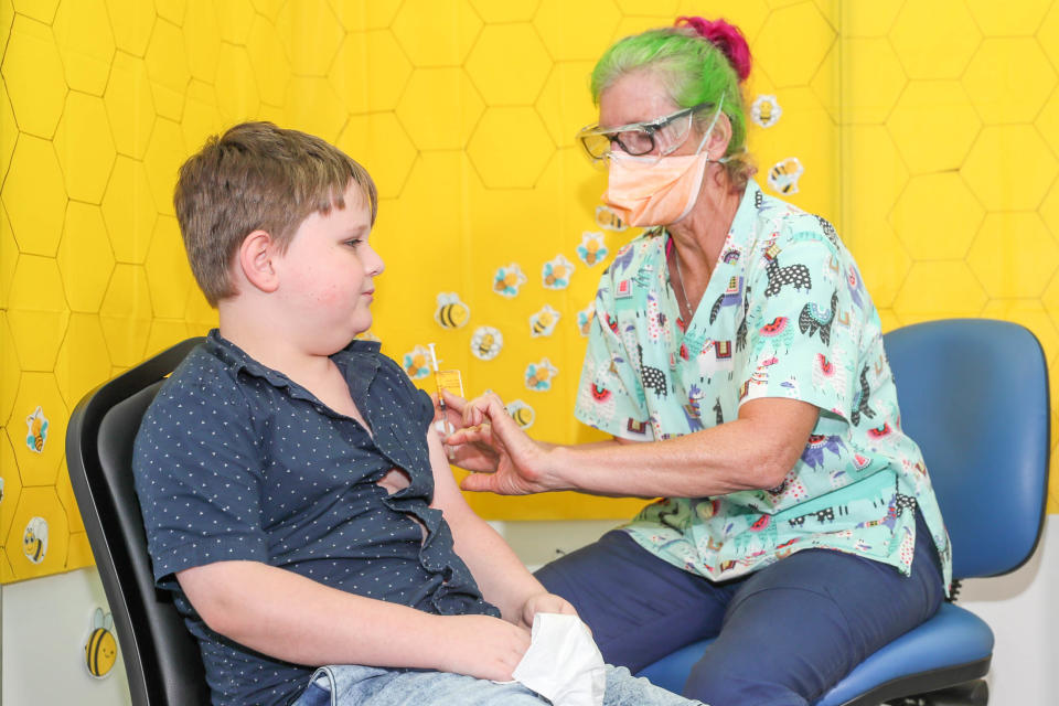 A 10-year-old boy gets his Covid vaccine.