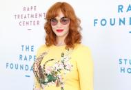 Christina Hendricks stands tall at the Rape Foundation's annual brunch at a private estate in Beverly Hills on Sunday.