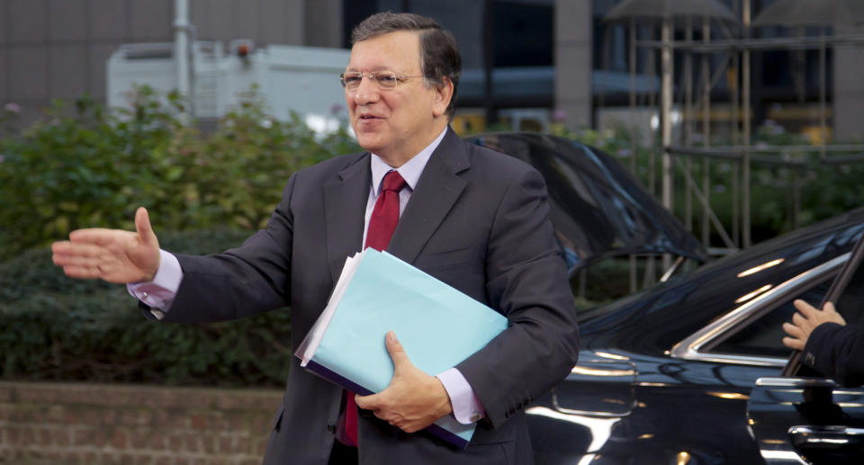 European Commission President Jose Manuel Barroso jestures toward journalists as he arrives for an EU summit at the EU Council building in Brussels on Thursday, Nov. 22, 2012. EU leaders begin what is expected to be a marathon summit on the budget for the years 2014-2020. The meeting could last through Saturday and break up with no result and lots of finger-pointing. (AP Photo/Virginia Mayo)