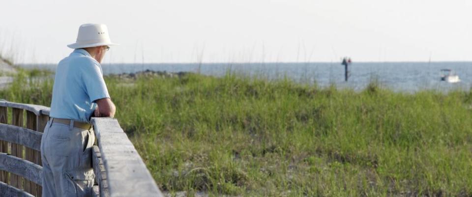 A senior man enjoying the view on the Alabama gulf coast.