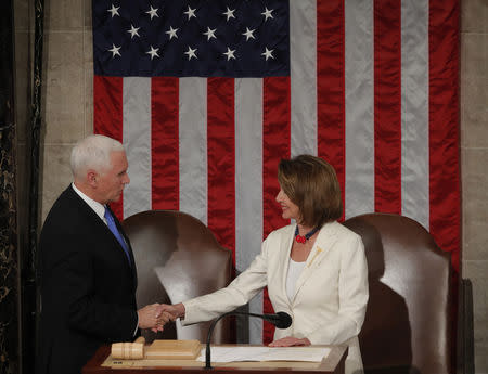 Vice President Mike Pence greets Speaker of the House Nancy Pelosi before President Trump delivers his State of the Union address. REUTERS/Jim Young