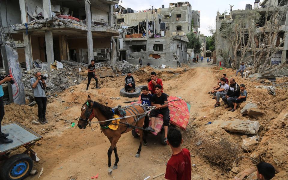 Palestinians at Bait Hanoun city northern the Gaza Strip checking their destroyed house - Mahmoud Khattab /Zuma Press / eyevine 