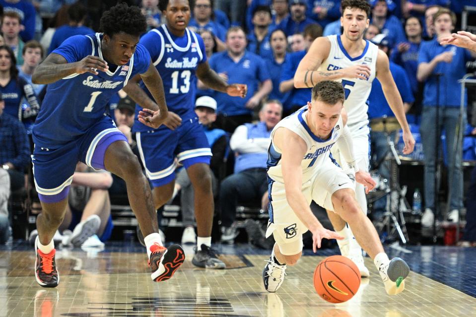 Feb 28, 2024; Omaha, Nebraska, USA; Seton Hall Pirates guard Kadary Richmond (1) and Creighton Bluejays guard Steven Ashworth (1) reach for a loose ball in the first half at CHI Health Center Omaha. Mandatory Credit: Steven Branscombe-USA TODAY Sports