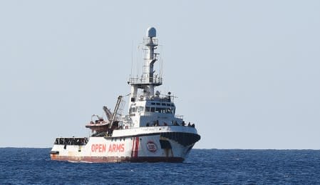 Spanish migrant rescue ship Open Arms is seen arriving close to the Italian shore as a Rome administrative court rules it can enter Italian territorial waters, in Lampedusa