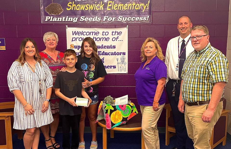 From left to right: Shawswick Elementary Assistant Principal Kelsey Pace, Bedford Revitalization, Inc. President Susan Gales, Brody and Sharissa Phillips, Bedford Revitalization, Inc. Design Committee Member Addie Datish, Shawswick Elementary Principal Brian Perry and Bedford Revitalization, Inc. Design Committee Member Tim Thompson.