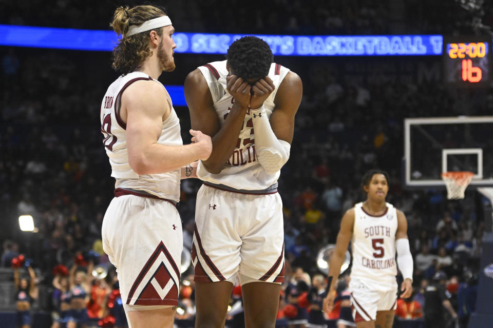 South Carolina forward Gregory Jackson II (23) reaccts as forward Hayden Brown (10) consoles as an NCAA college basketball game against Mississippi, in the first round of the Southeastern Conference tournament, comes to an end, Wednesday, March 8, 2023, in Nashville, Tenn. Mississiippi won 67-61. (AP Photo/John Amis)