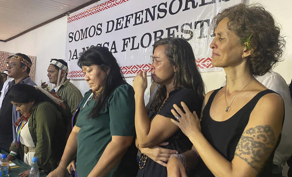 Alessandra Sampaio, widow of British journalist Dom Phillips, right, Beatriz Matos, widow of Indigenous expert Bruno Pereira, second right, Sonia Guajajara, Brazil's first Minister of Indigenous Peoples, left, and Joenia Wapichana, President of the National Foundation for Indigenous Peoples, attend a ceremony in Atalaia do Norte, Vale do Javari, Amazonas state, Brazil, Monday, Feb. 27, 2023. In a symbolic gesture, a high-level delegation from the Brazilian government paid a visit on Monday to the region where the Indigenous expert Bruno Pereira and British journalist Dom Phillips were murdered last year. (AP Photo/Fabiano Maisonnave)