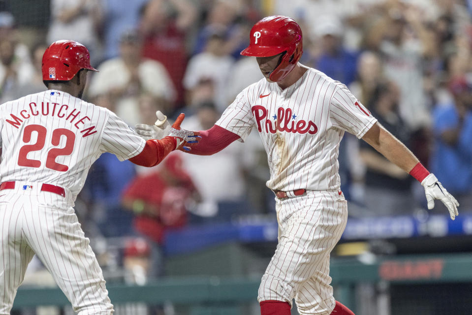 Philadelphia Phillies' Rhys Hoskins (17) celebrates with Andrew McCutchen (22) after hitting a three-run home run during the sixth inning of a baseball game against the Washington Nationals, Monday, July 26, 2021, in Philadelphia. (AP Photo/Laurence Kesterson)