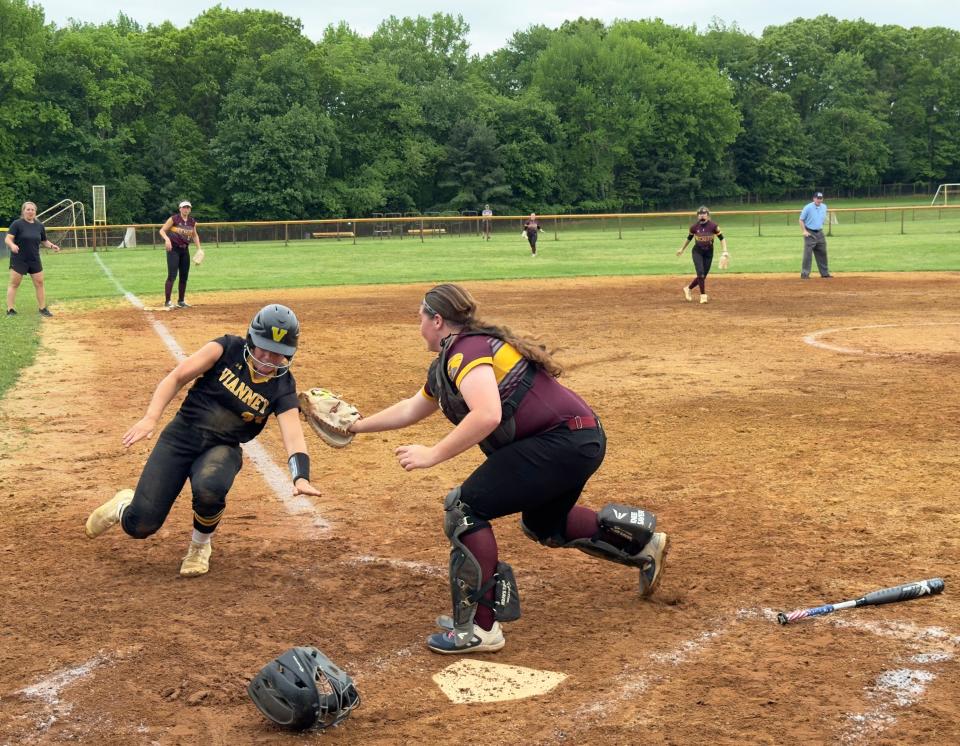 Central Regional catcher Sophia Capasso tags out Elisabeth Figliolino to save a run.