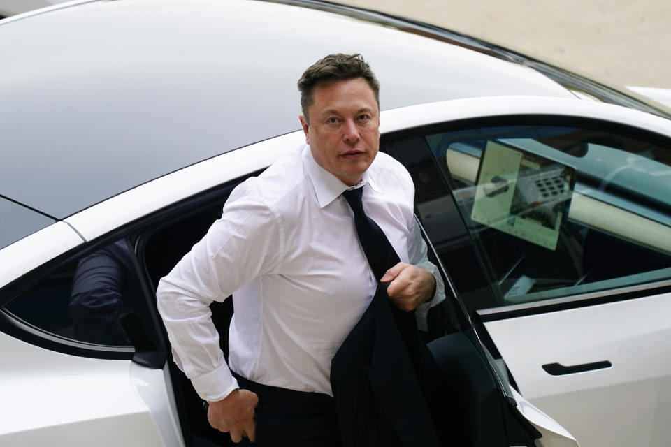 Elon Musk arrives at the justice center in Wilmington, Del., Tuesday, July 13, 2021. Musk took to a witness stand Monday to defend his company's 2016 acquisition of a troubled company called SolarCity against a shareholder lawsuit that claims he's to blame for a deal that was rife with conflicts of interest and never delivered the profits he had promised. (AP Photo/Matt Rourke)