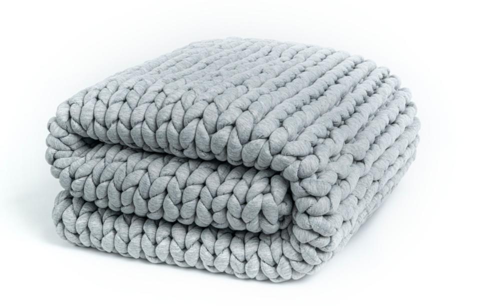 If you love the feeling of your favorite worn-in band tee, you'll drool over this stuffed jersey hand-knitted blanket. It comes in gray and cream in 10 and 15 pounds, both measuring 50 inches by 60 inches. The open knit makes it breathable and easy to sleep with. Promising review: 