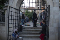 Kosovo Muslim men attend an Eid al-Fitr prayer marking the end of the holy fasting month of Ramadan outside Imperial mosque in capital Pristina, Kosovo on Thursday, May 13, 2021. Muslims around the world are celebrating Eid al-Fitr, the three day festival marking the end of the Muslim holy fasting month of Ramadan. Eid al-Fitr is one of the two major holidays in Islam. (AP Photo/Visar Kryeziu)