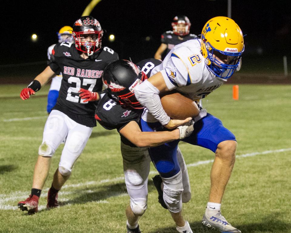 Meyersdale’s Spencer Whitfield makes a big 4th down stop on Glendale quarterback Troy Misiura deep in Red Raider territory during an Inter-County Conference football matchup, Sept. 1, in Meyersdale.