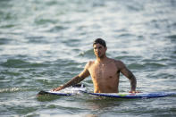 Surfer Gabriel Medina of Brazil comes out of the water after working out on a Surf Ranch wave during practice rounds for the upcoming Olympics Wednesday, June 16, 2021, in Lemoore, Calif. This year, Medina and fellow Brazilian Italo Ferreira are expected to rule the men's competition at surfing's long-awaited debut as an Olympic sport in the Tokyo 2020 Games. While the surfing community has long pledged that the ocean is for everyone, a look at the professional ranks show a sport that remains expensive and inaccessible. A series of recent industry efforts to help groom the next generation outside of the usual hot spots of Hawaii, California and Australia look to be a tacit acknowledgement of the existing disparities among its talent bench. (AP Photo/Noah Berger)