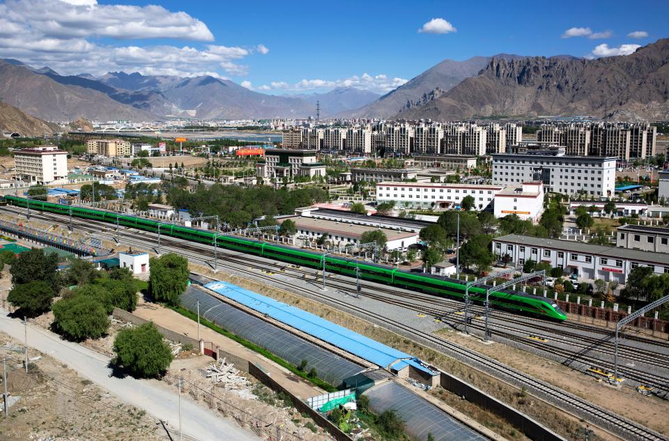 Fuxing bullet train traveling on railway in Tibet