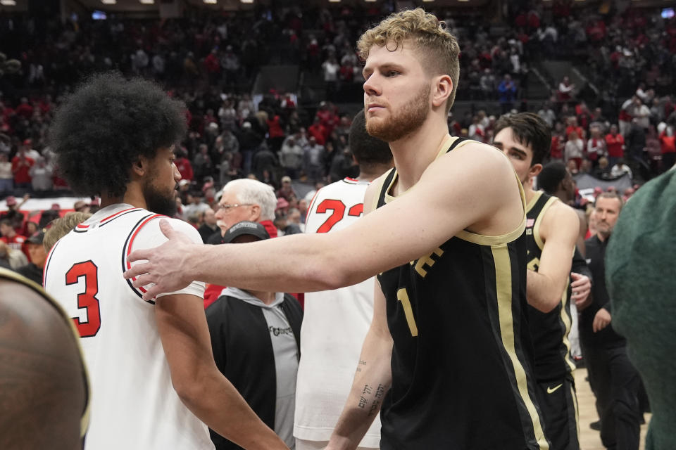 Purdue forward Caleb Furst, right, shakes hands with Ohio State guard Taison Chatman (3) after Ohio State defeated Purdue in an NCAA college basketball game, Sunday, Feb. 18, 2024, in Columbus, Ohio. (AP Photo/Sue Ogrocki)