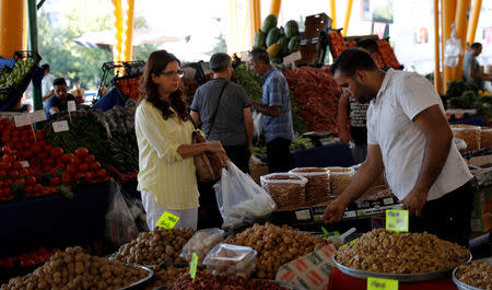 A stallholder sells fruits at a bazaar in Ankara, Turkey August 16, 2018. REUTERS/Umit Bektas