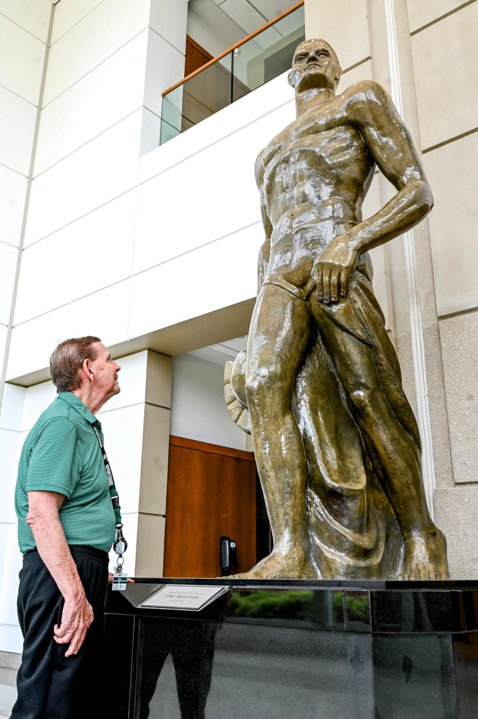 Cyrus Stewart, one of the first Sparty mascots, looks at the Sparty statue on Wednesday, June 14, 2023, at Spartan Stadium on the Michigan State University campus in East Lansing.