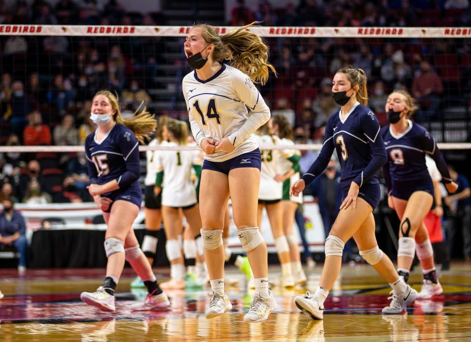 Freeport Aquin's Hanna Pizzolato (14) celebrates a point against Champaign St. Thomas More during the semifinals of the IHSA Class 1A State Final Tournament at Redbird Arena in Normal, Ill., Friday, November 12, 2021. [Justin L. Fowler/The State Journal-Register] 