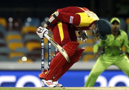 Zimbabwe's Craig Ervine is struck by a short delivery from Pakistan's Mohammad Irfan during their Cricket World Cup match at the Gabba in Brisbane March 1, 2015. REUTERS/Jason Reed