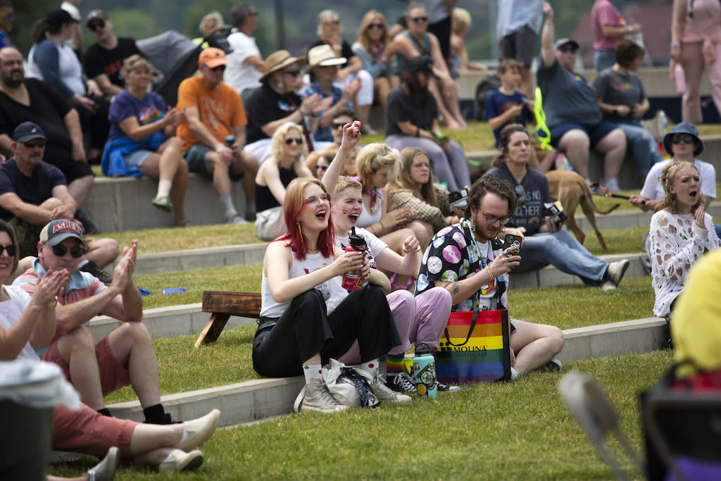 Attendees cheer at the west Michigan city of Grand Haven’s first Pride Fest in June. The surrounding county of Ottawa had more people moving in than any other in the swing state. Like many other fast-growing counties, Ottawa is staunchly Republican but becoming more Democratic. (Photo by Kristen Norman/The Associated Press)