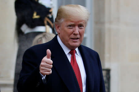 U.S. President Donald Trump gestures as he leaves after a meeting at the Elysee Palace on the eve of the commemoration ceremony for Armistice Day, 100 years after the end of the First World War, in Paris, France, November 10, 2018. REUTERS/Vincent Kessler