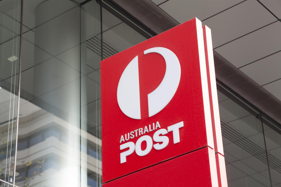 An Australia Post sign outside an office.