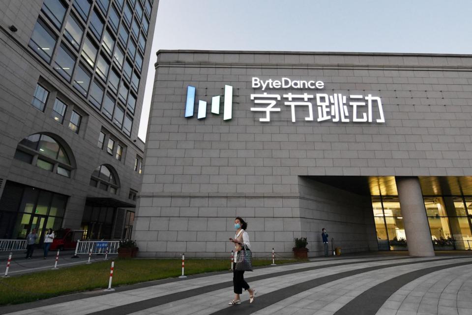 PHOTO: A woman walks past the headquarters of ByteDance, the parent company of video sharing app TikTok, in Beijing, Sept. 16, 2020.  (Greg Baker/AFP via Getty Images, FILE)