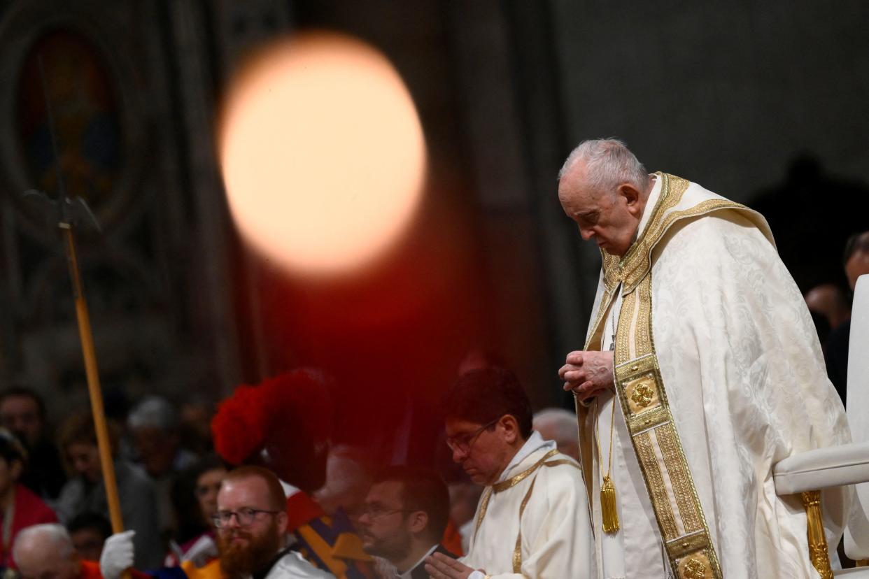 Pope Francis presides over the Easter Vigil in St Peter’s Basilica (Reuters)