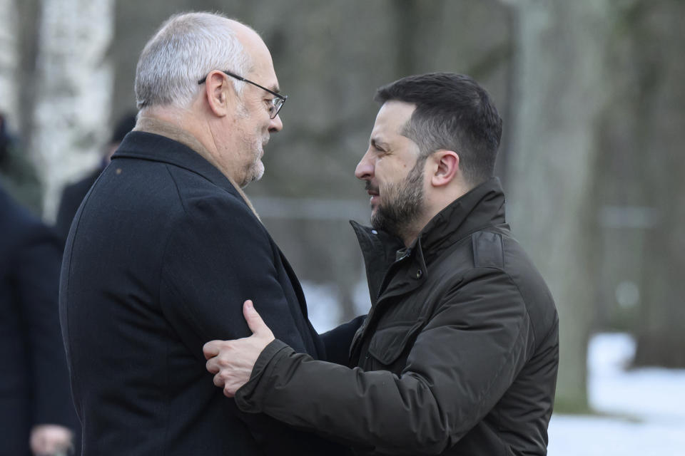 In this photo provided by the Office of the President of the Republic of Estonia, Estonia's President Alar Karis, left, welcomes Ukrainian President Volodymyr Zelenskyy, in Tallinn, Estonia, Thursday, Jan. 11, 2024. (Raigo Pajula/Office of the President of the Republic of Estonia via AP)